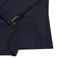 Close-up of navy blue maternity blazer with gold buttons and adjustable fit blazers for women.