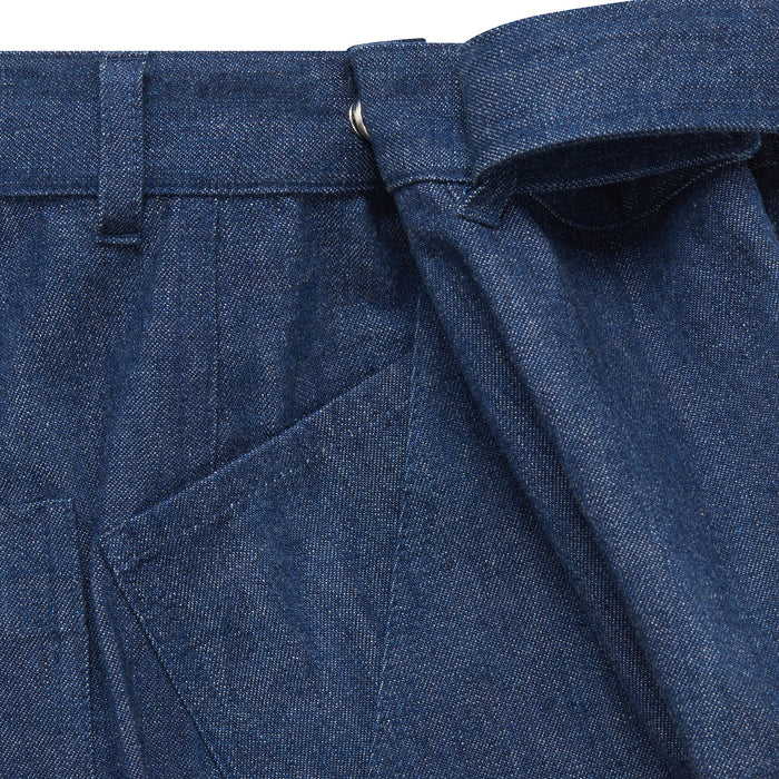 Close-up of blue adjustable waist jeans showing front pocket, belt loop and adjustable tie waist.